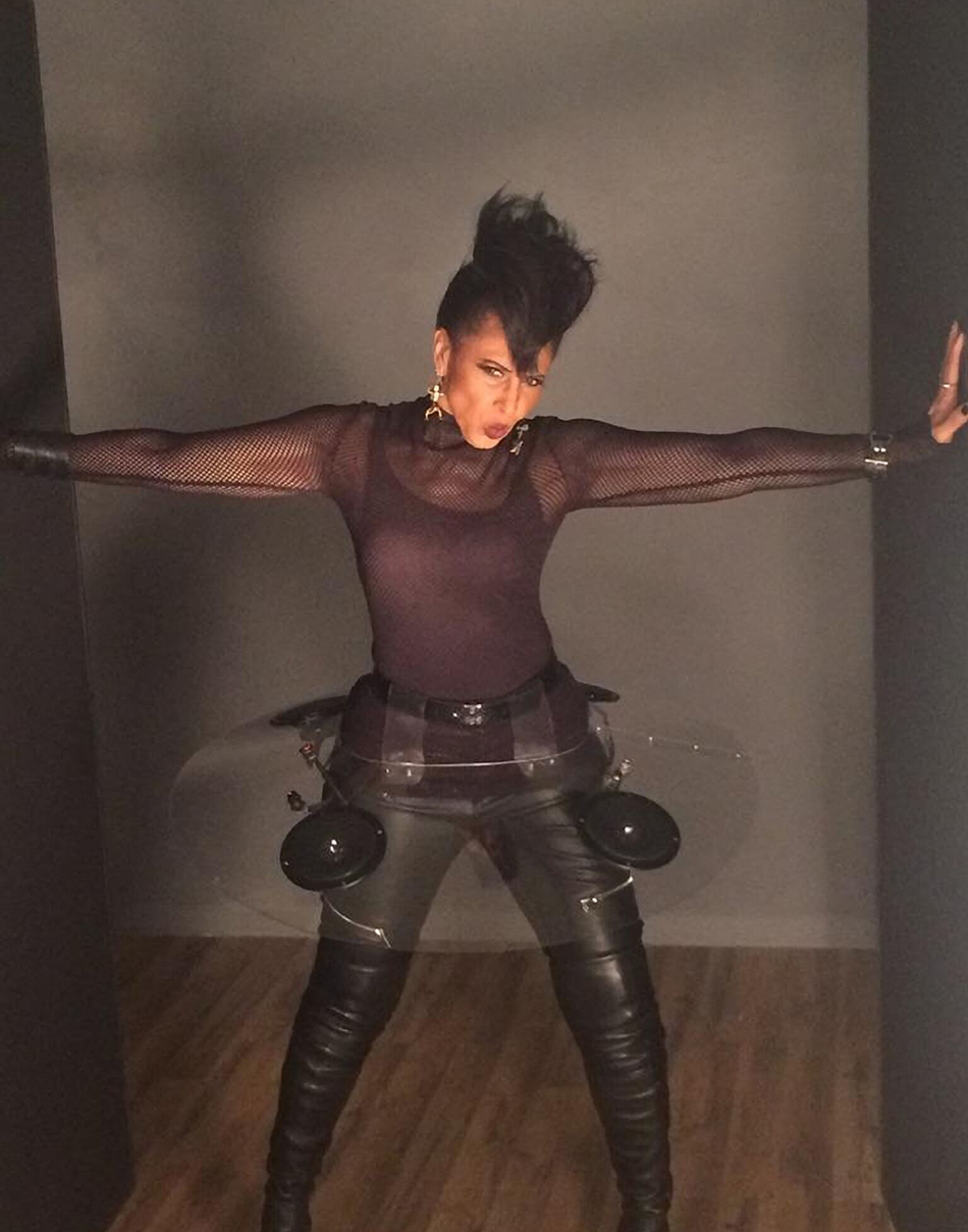 Nona Hendryx striking a pose with her arms out in a black outfit and her "audio tutu".