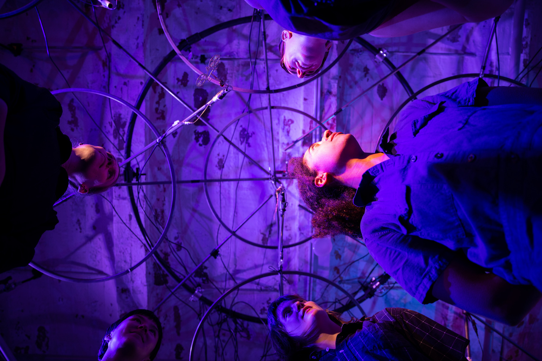 looking up at the "[ ]" hanging sonic sculpture and 5 dancers 