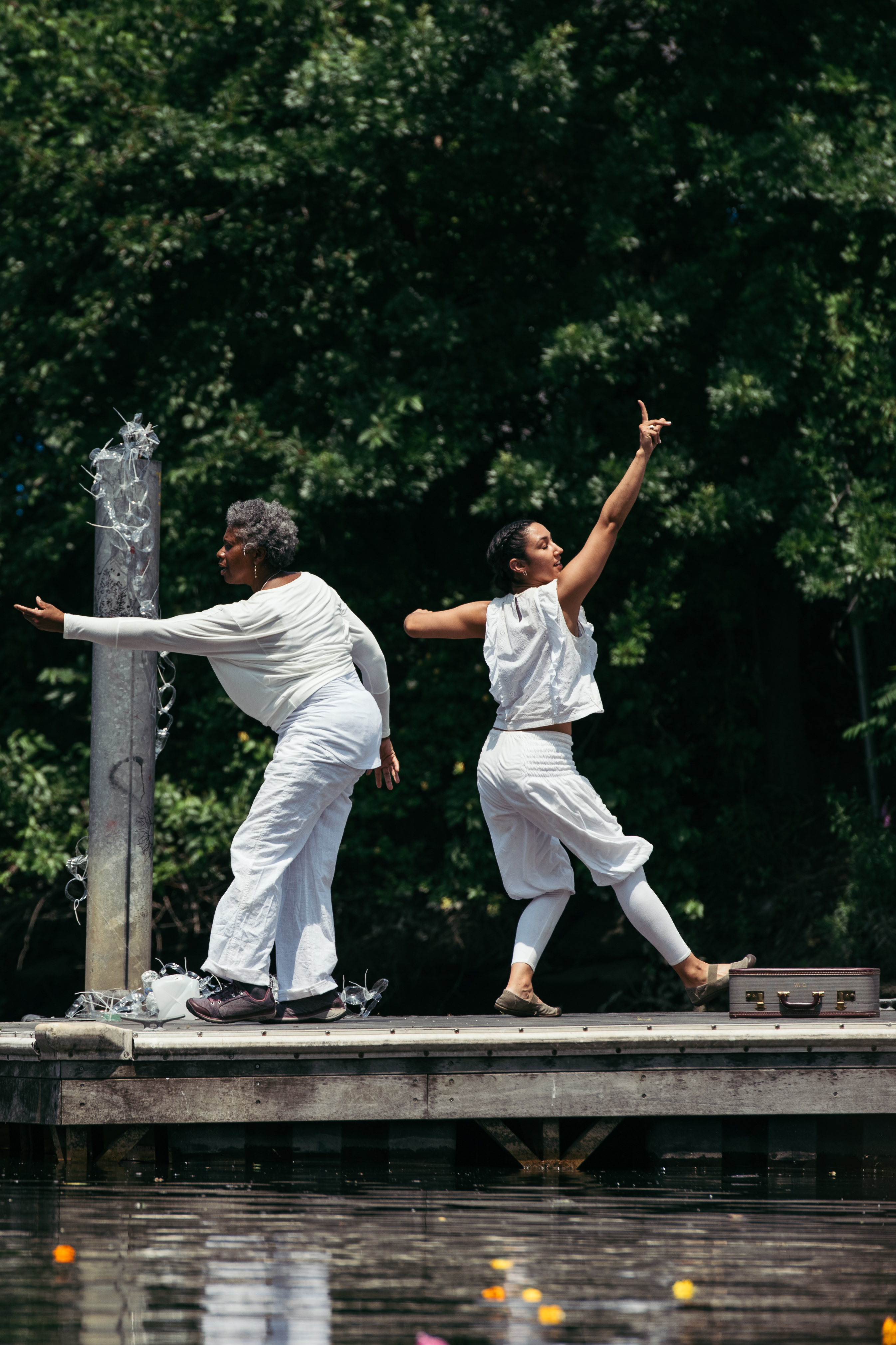 Angela's Pulse Core Collaborators Christine King and Erica Saucedo in Building a Better Fishtrap / from the river's mouth performance ritual on the Bronx River, July 2018.